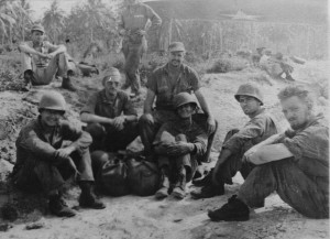 The crew under the wing of his B-17 at an airfield on Guadalcanal. He's front left.